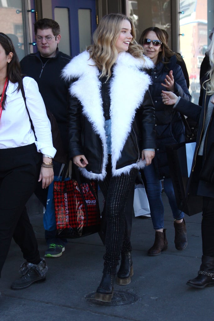 Anya kept warm in Park City, Utah, sporting her oversize, shearling leather jacket with knit lettings and platform boots.