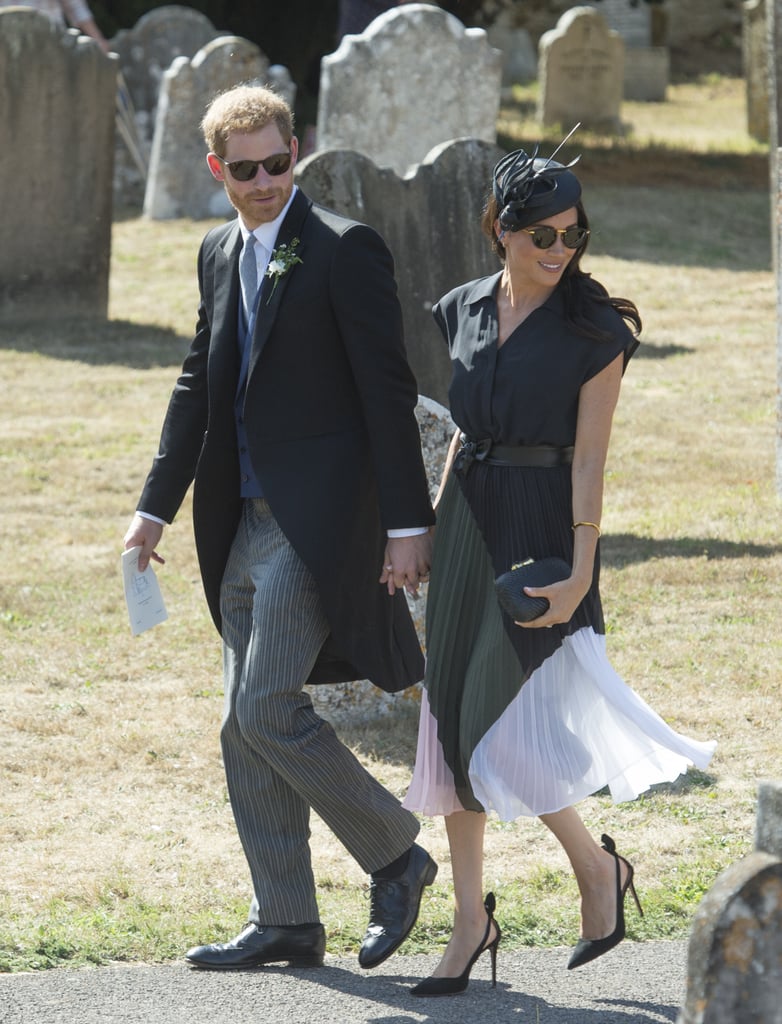 Meghan stepped out for Daisy Jenks and Charlie van Straubenzee's wedding on her birthday in this bold, colourblock Club Monaco dress.