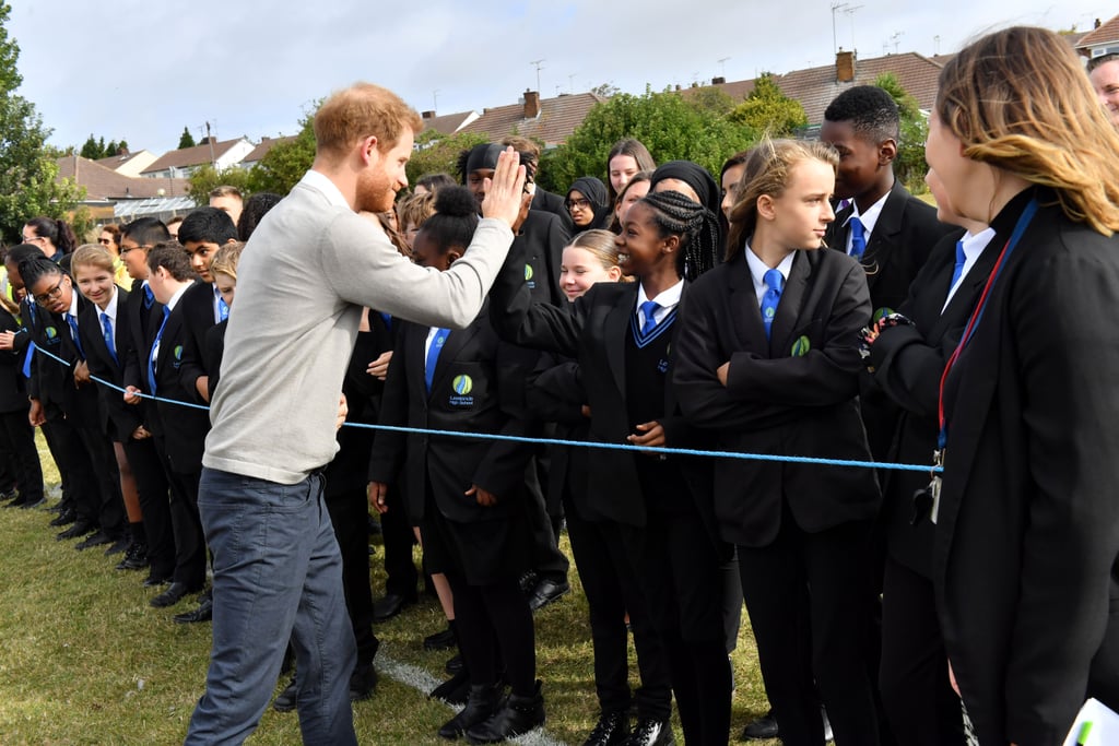 Prince Harry Hugs Kids at Lealands High School