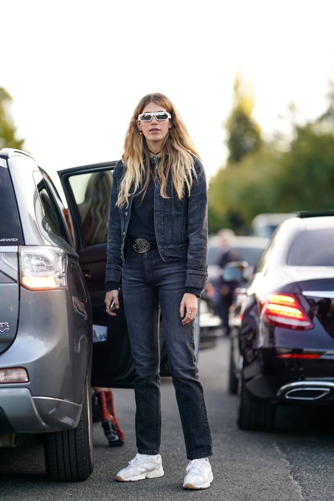 The perfect look for running errands: a dark-wash denim jacket and jeans, a t-shirt, and sneakers.