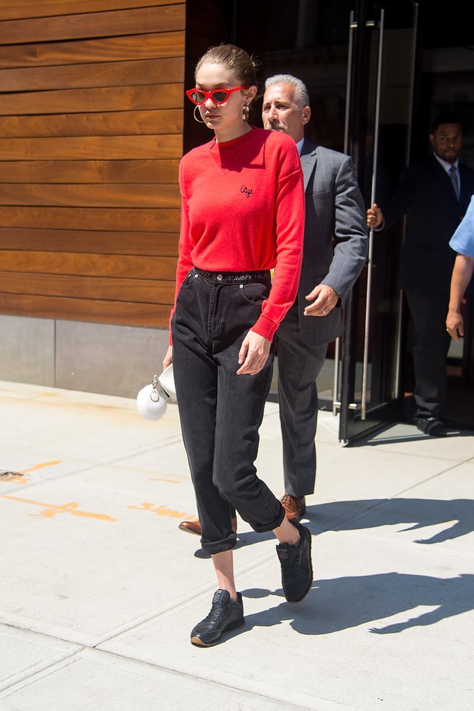 Welcome Fall in a bold red sweater like Gigi's. The model also matched her top to her sunglasses.