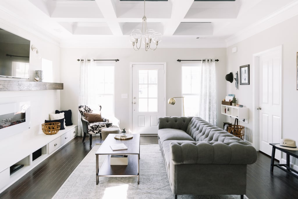 One concern of the homeowner's was that it would be awkward to walk from the home's main entrance directly into the living room. Monica resolved this problem by leaving several feet of open space directly around the door. Then, she designated a natural walkway behind the chesterfield sofa ($1,678) to usher guests into the main house.