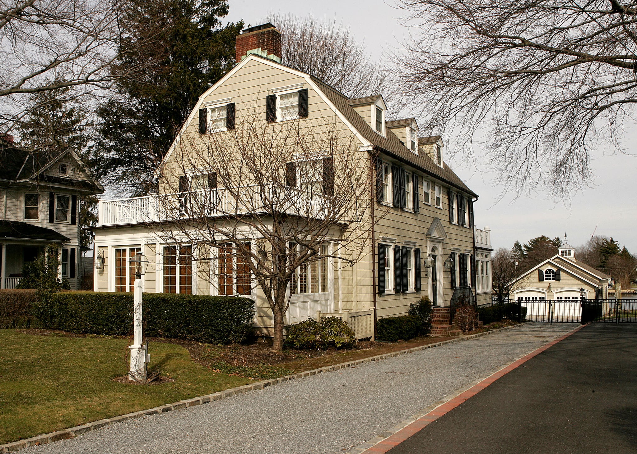 NEW YORK - MARCH 31:  Real estate photograph of a house located at 112 Ocean Avenue in the town of Amityville, New York March 31, 2005. The Amityville Horror house rich history and beauty are overshadowed by the story of George and Kathy Lutz, the previous residents of 112 Ocean Avenue, who claimed that shortly after moving into the house they fled in terror driven out by paranormal activity. The best selling novel and popular movie have marked the town as the site of the most famous haunted house in history, yet many are unaware that the true history of this house is much darker than 