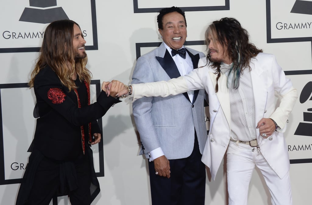 Jared clasped Steven Tyler's hand as Smokey Robinson looked on.
