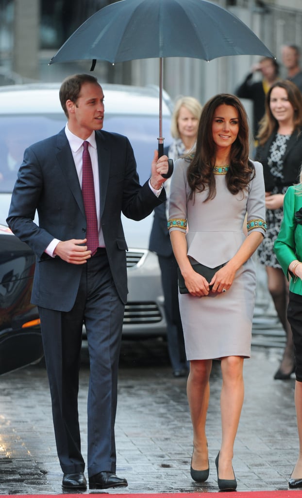 William held an umbrella over Kate's head while heading into a London theater in April 2012.