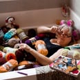 "Grandma Gone Wild" Photo Shoot Features Woman Posing For Boudoir Photos in Bathtub Full of Yarn