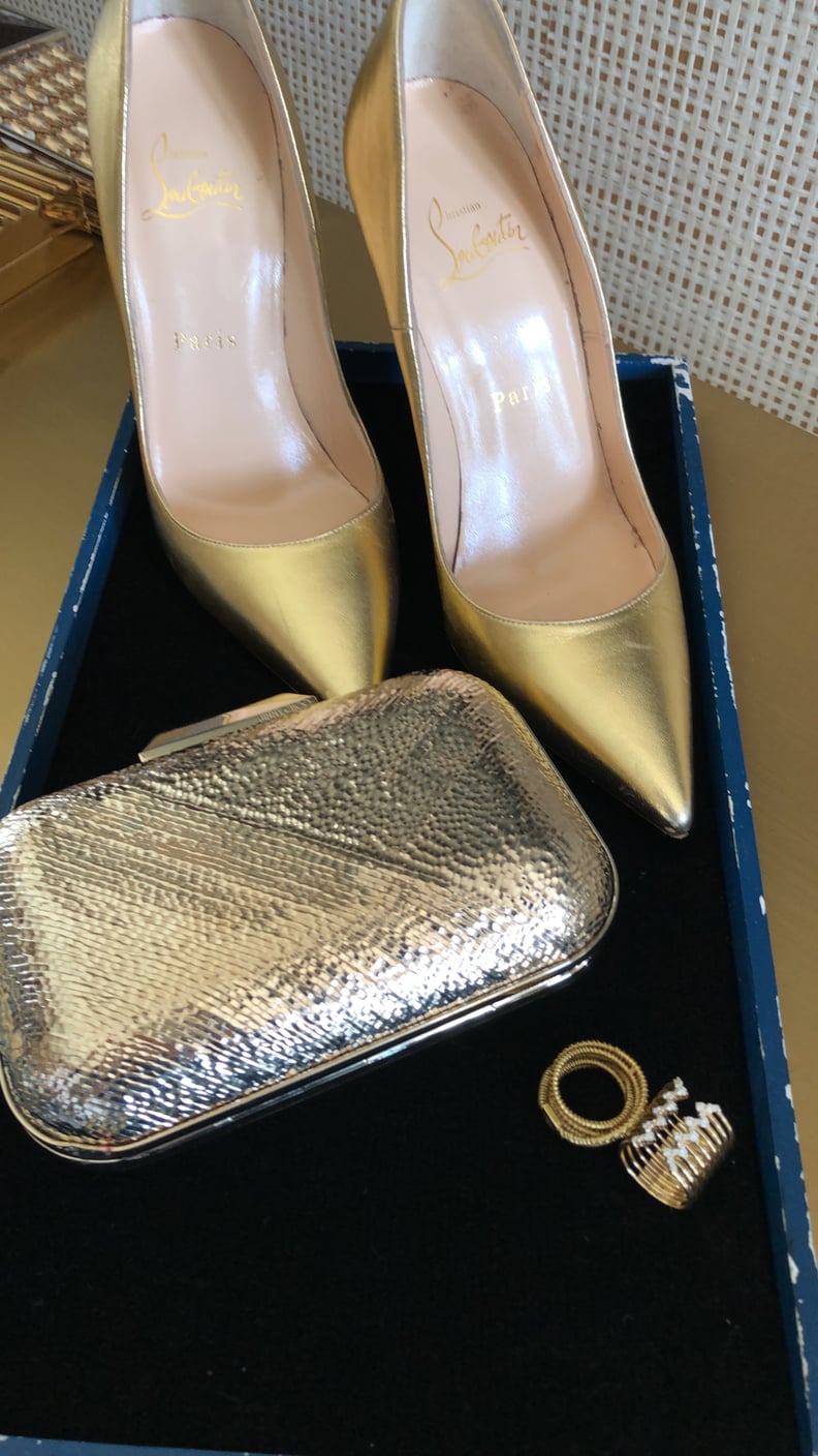 Olivia's Accessories Include Gold Christian Louboutin Pigalle Pumps