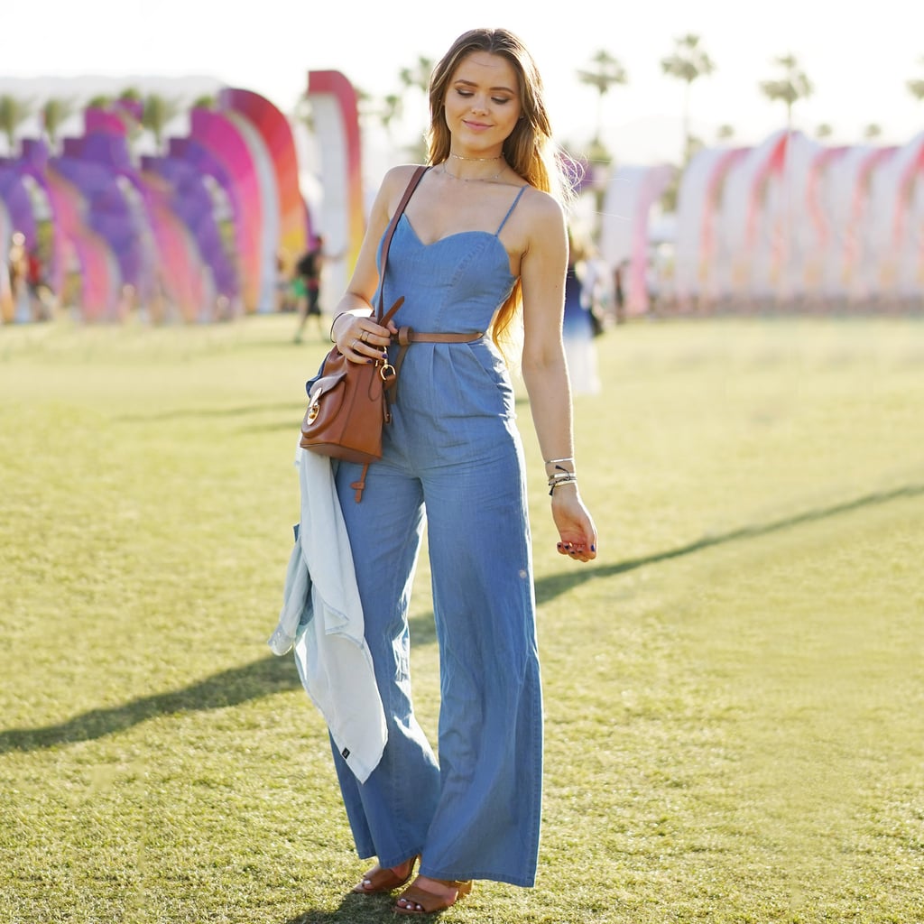 The perfect denim jumpsuit got topped off with neutral wedges, a skinny belt, and a midsize crossbody bag.