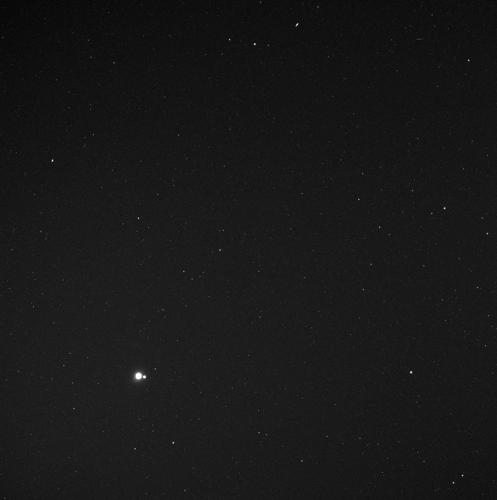 You might have to look hard to see it, but the Messenger captured this view of the Earth and the moon from Mercury on May 6, 2010. The spacecraft was a whopping 114 million miles away from Earth. 
Source: Messenger Science Team/NASA