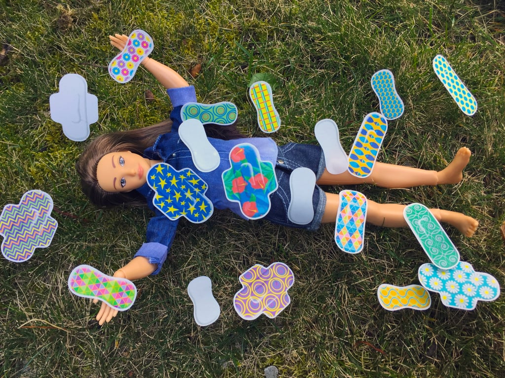 The Period Party add-on pack, complete with an educational pamphlet and an array of colorful pads and panty liners, is sold in addition to a pack of stretch mark, cellulite, and acne stickers that you can place on the doll.