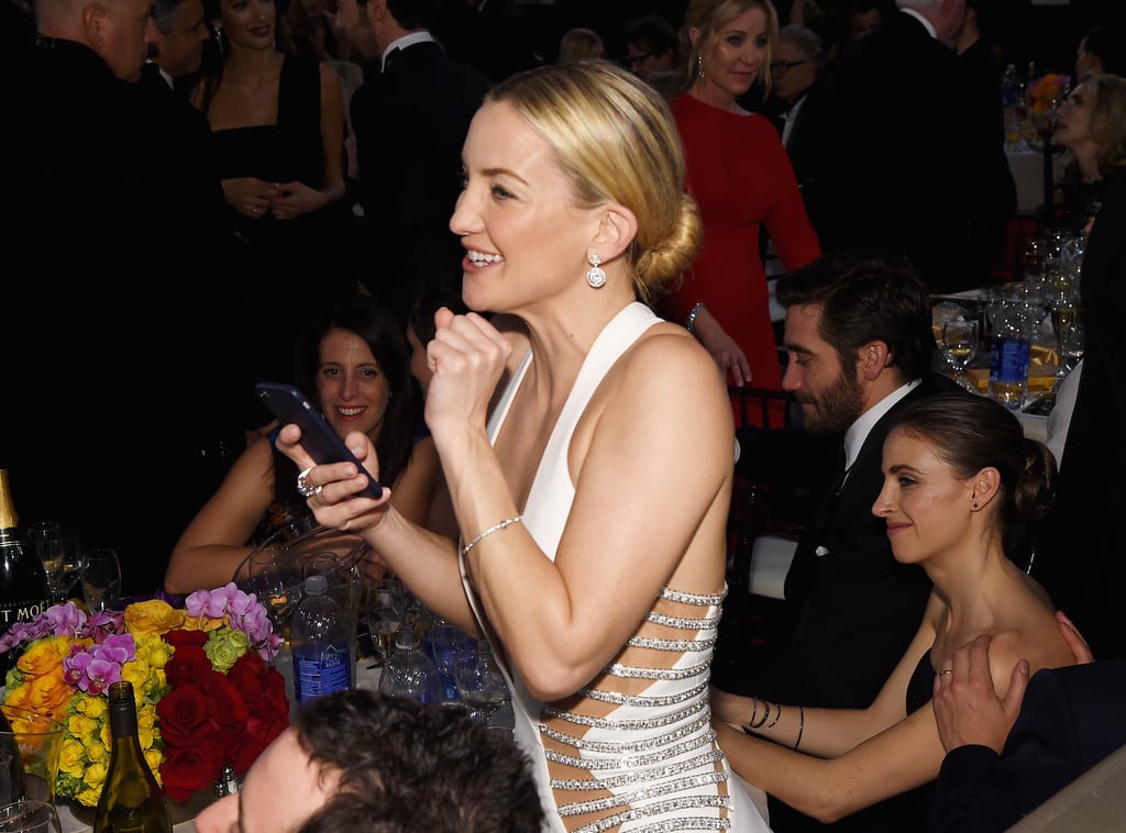 Kate Hudson was all smiles as she checked out her phone.