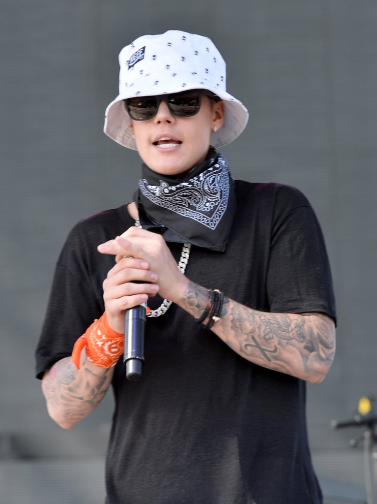 Justin Bieber wore a bucket hat, a black bandanna, and sunglasses when he made a surprise appearance on stage.