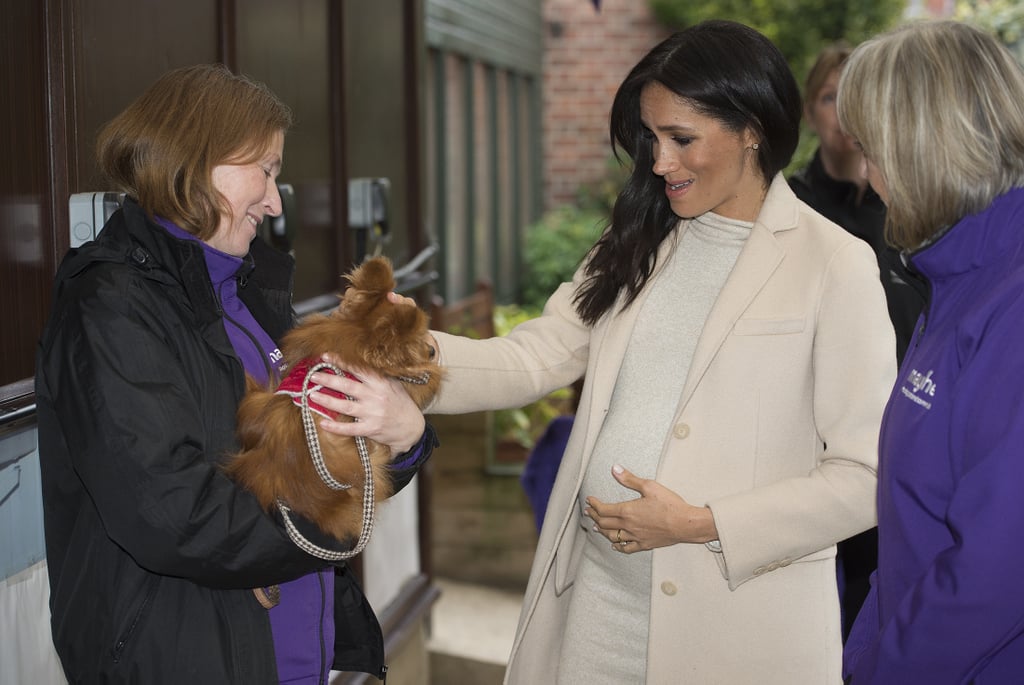 Meghan Markle Touching Baby Bump Pictures