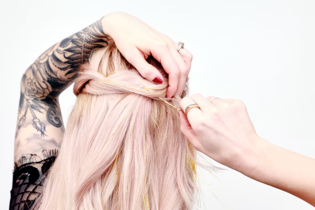 Secure the braids to your crown by sliding bobby pins underneath the spot where the braid intersects, then upward into your plaits.
