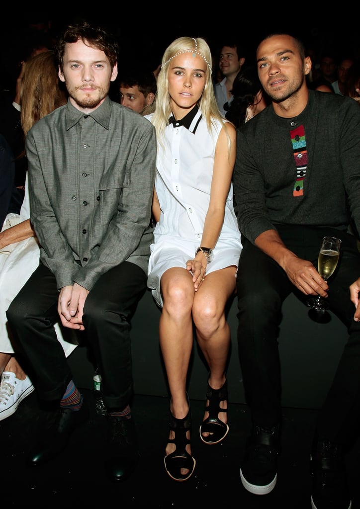 Isabel Lucas paired flat gladiator sandals with a black-collared white dress at the Y-3 show.
Isabel Lucas paired flat gladiator sandals with a black-collared white dress at the Y-3 show.
