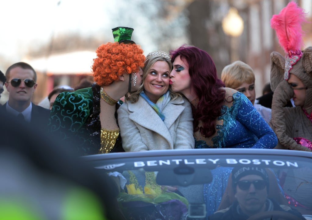 Amy Poehler found herself in a smooch sandwich during an eventful stop at Harvard University in Cambridge, MA, on Thursday.