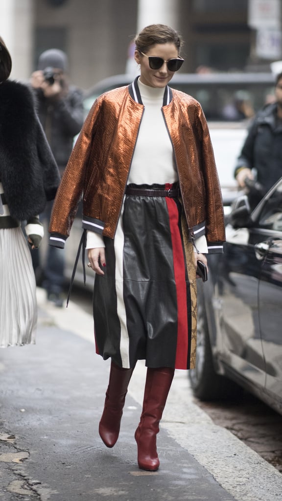 Olivia draped her bomber jacket over her shoulders outside the Salvatore Ferragamo show.