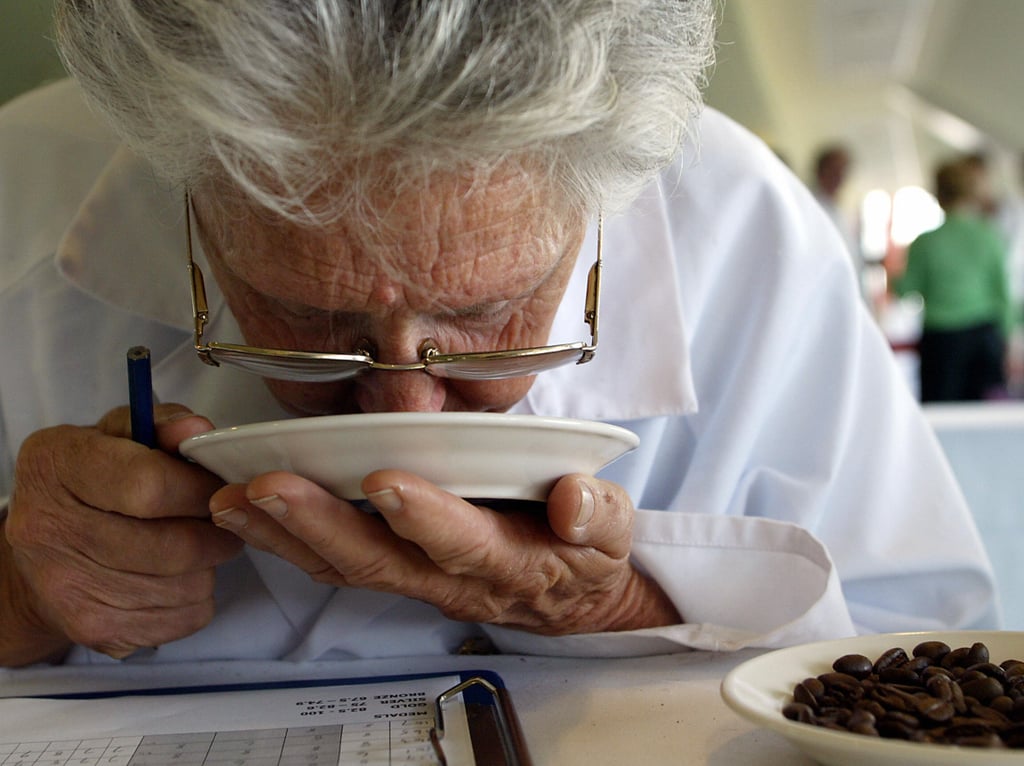 At the roasting plant, coffee is tasted for quality assurance.