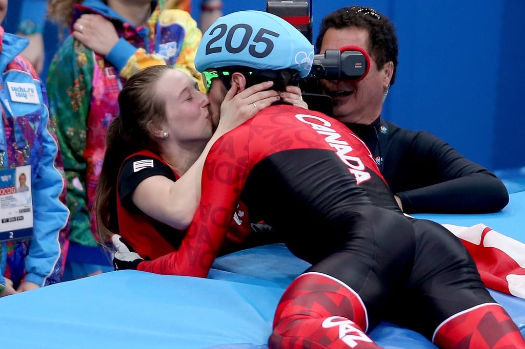 Canada's Charles Hamelin gave his teammate and girlfriend Marianne St-Gelais a big kiss after winning the gold medal in the short-track men's 1500m speed skating final.