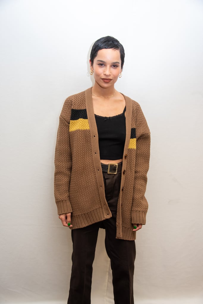 While promoting High Fidelity, Zoë showed us how to dress it down in a brown cardigan, black crop top, and high-waisted pants.