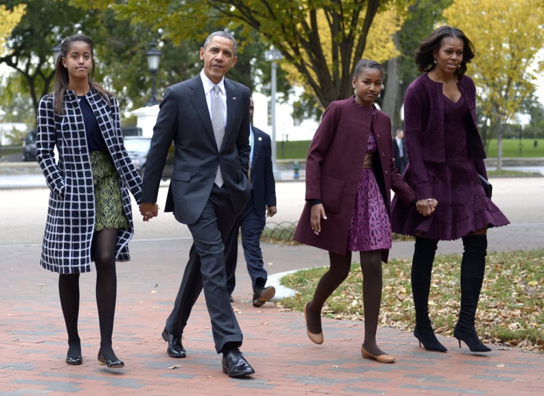 WASHINGTON, DC - OCTOBER 27:  U.S. President Barack Obama walks with his wife Michelle Obama (R) and two daughters Malia Obama (L) and Sasha Obama (2R) through Lafayette Park to St John's Church to attend service October 27, 2013 in Washington, DC. Obama 