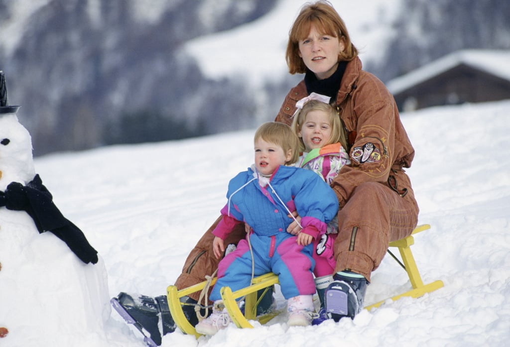 The young princesses were cuddled by their mom during a toboggan ride in 1992.