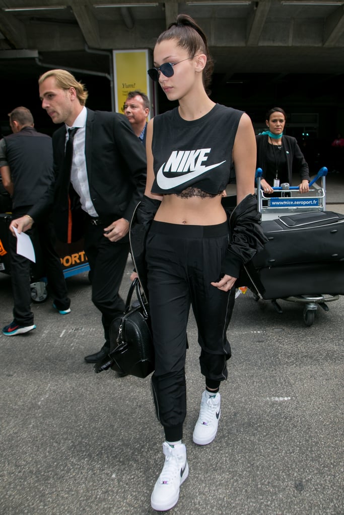 Do you dare to wear a crop top on a flight? Follow Bella Hadid's lead and keep it casual with some sweats and sneakers.