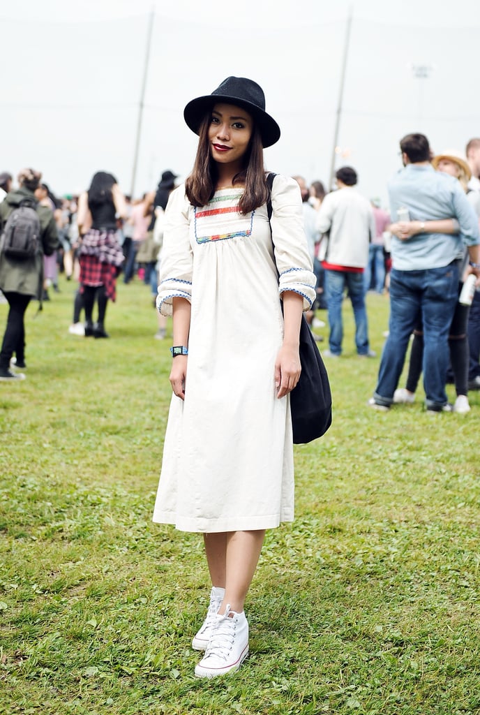 This cool vintage dress got a modern update with a black Urban Outfitters hat and platform Converse.