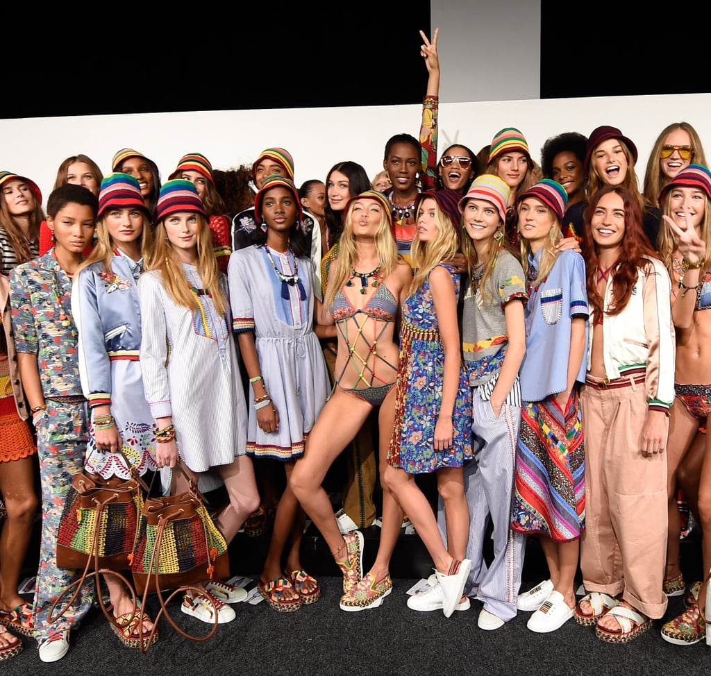 Gigi was the queen bee at the Tommy Hilfiger show, posing with the rest of the models backstage in her colorful suit and floral-print espadrille sneakers.