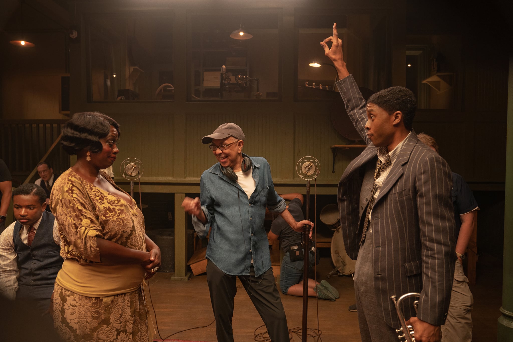 Ma Rainey's Black Bottom (2020): (L to R) Viola Davis as Ma Rainey, Director George C. Wolfe, and Chadwick Boseman as Levee. Cr. David Lee / Netflix