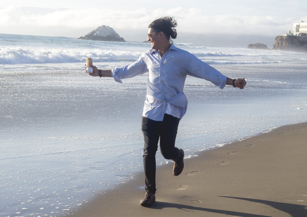 Running hand-in-foil along the beach.