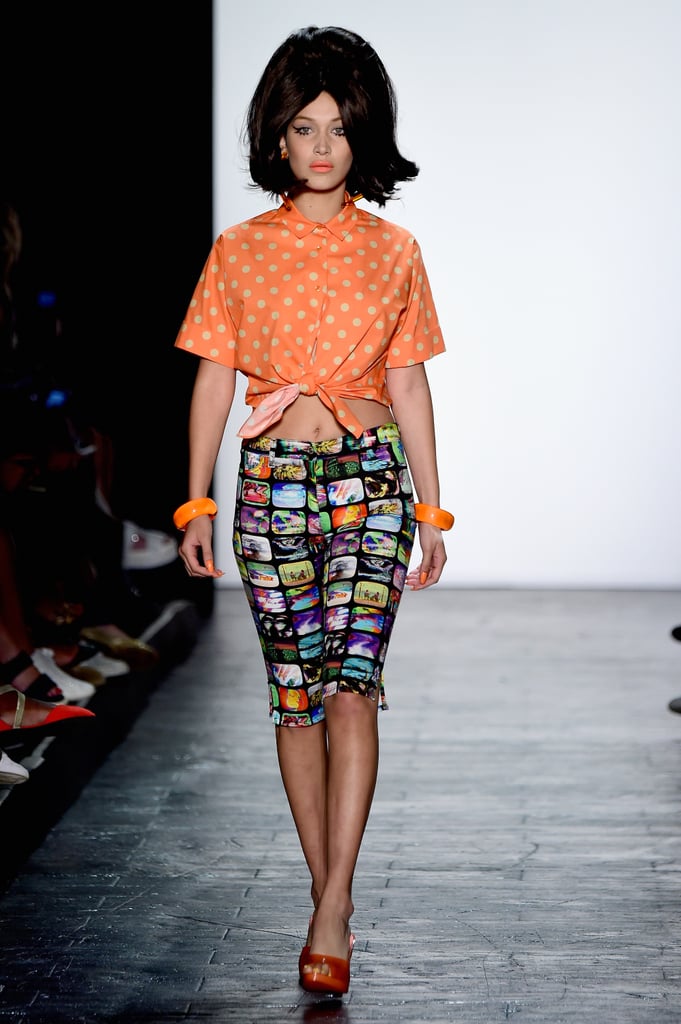 Bella wore a polka-dot button-down crop top with tight pedal pushers. She wore a couple of bangles and complementing orange pumps, making for a poppy, playful '50s look.