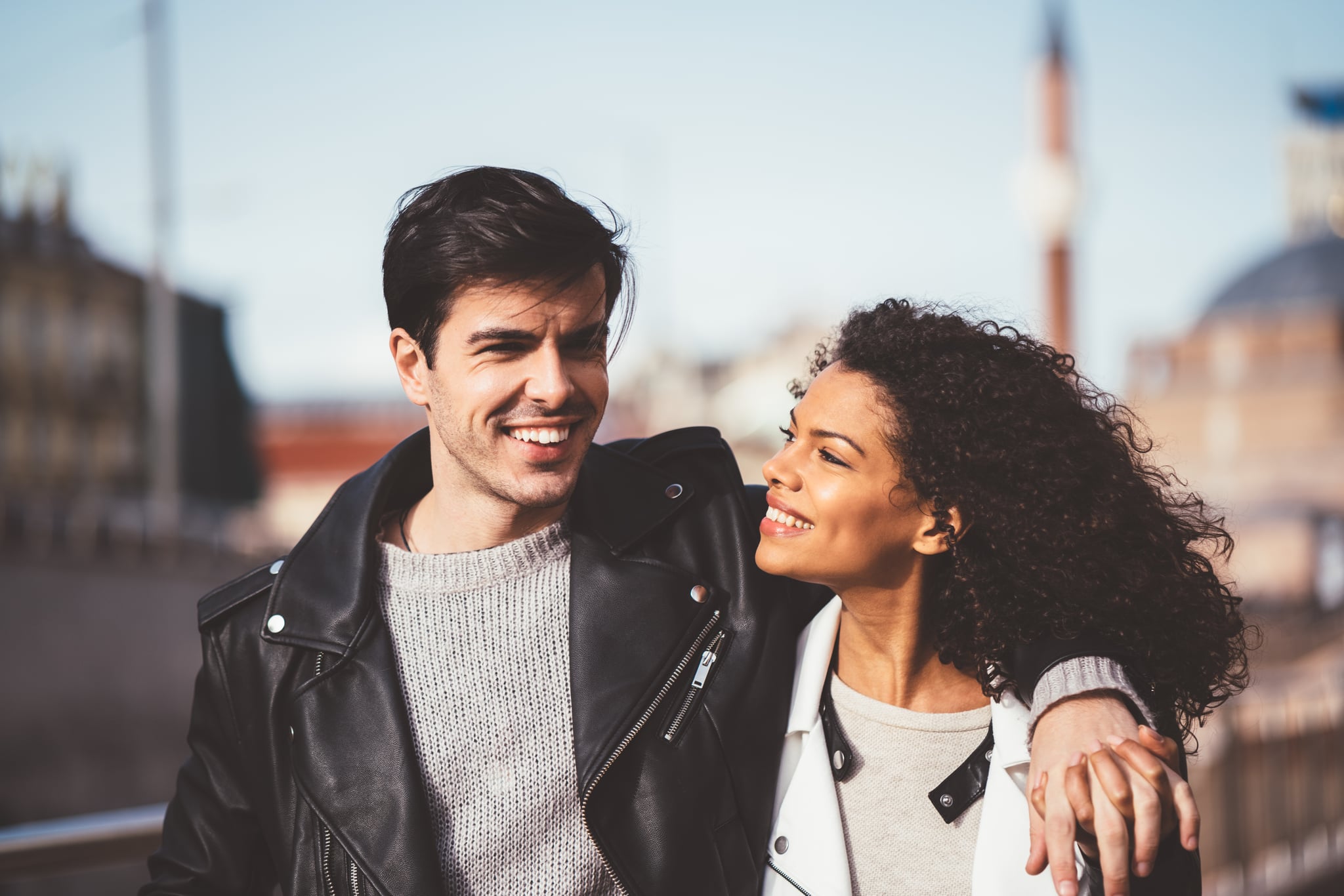 Happy couple walking in the city