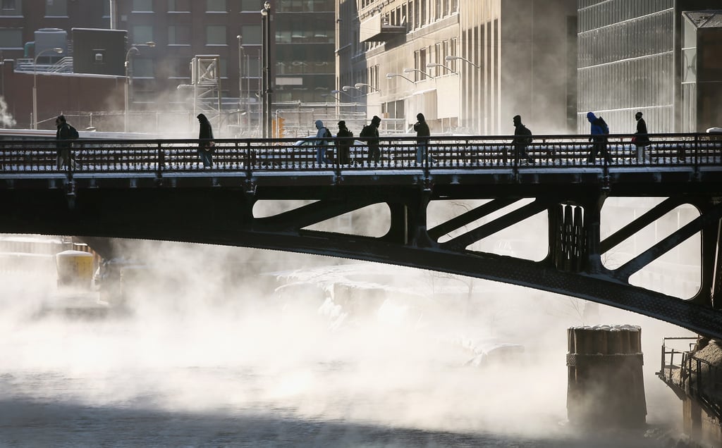 Commuters braved subzero temperatures as they crossed the Chicago River.