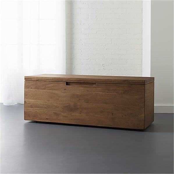 A storage bench works double duty, serving as extra seating as well a catch-all for living room clutter. This Acacia Storage Bench ($649) could be a home for extra throw blankets, children’s toys, or a collection of board games.