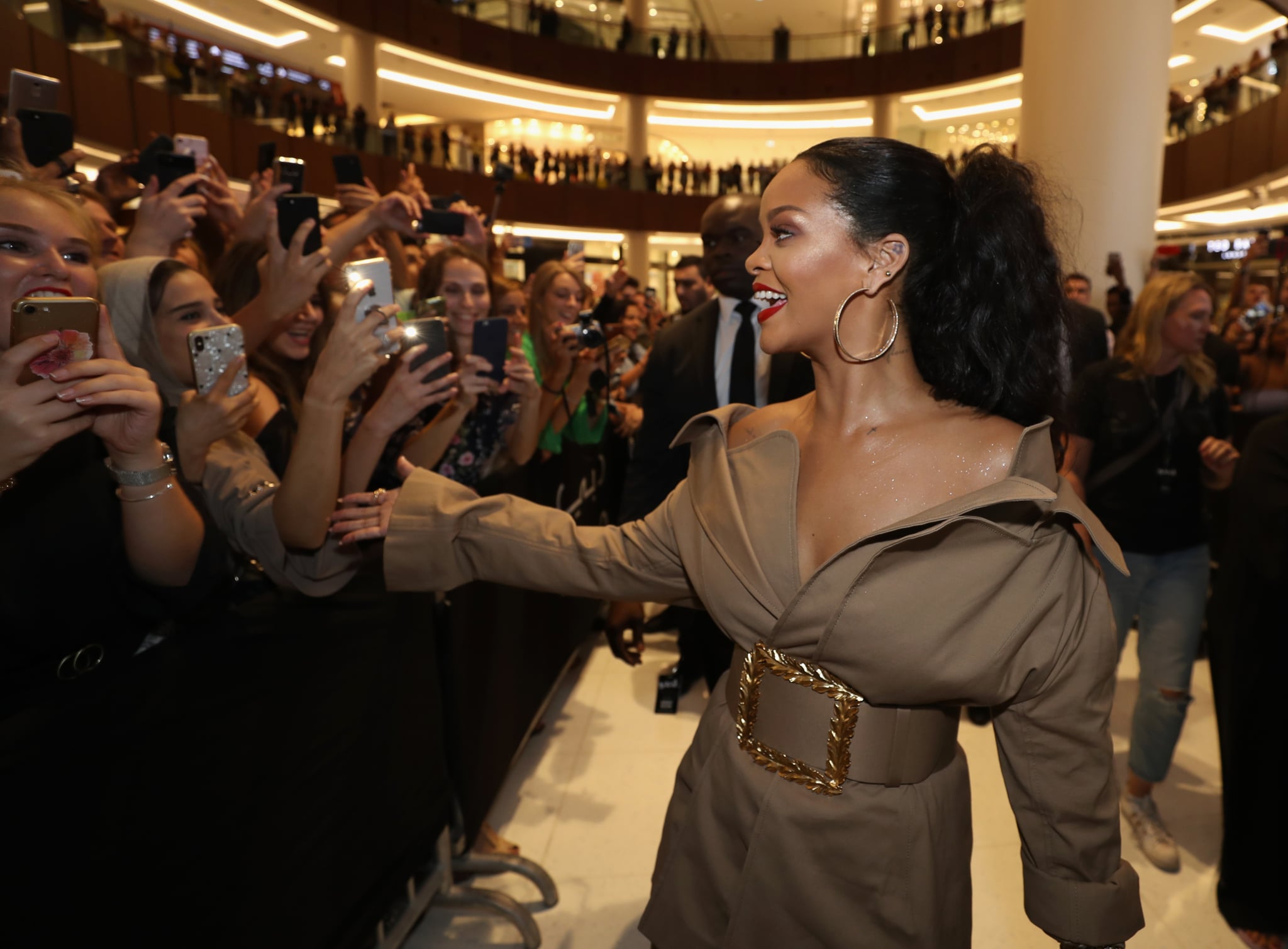 Rihanna at Fenty Beauty event in Dubai wearing an Oscar de la Renta coat  dress.