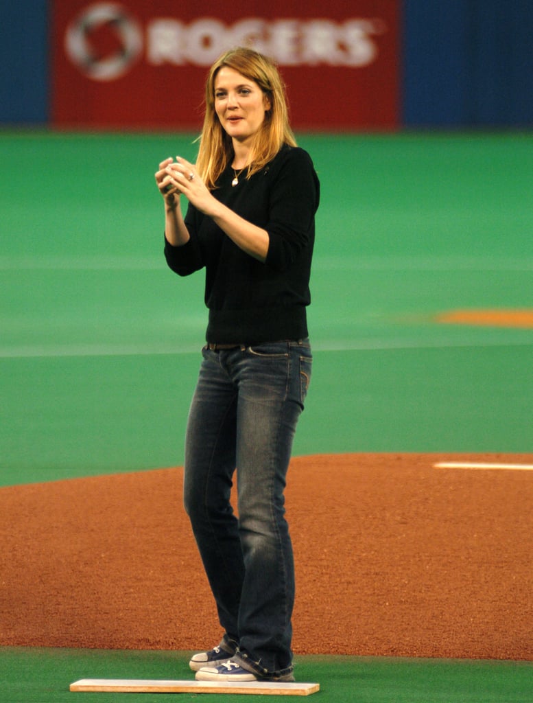 Drew Barrymore got ready to throw the first pitch at a Toronto Blue Jays game in October 2004.