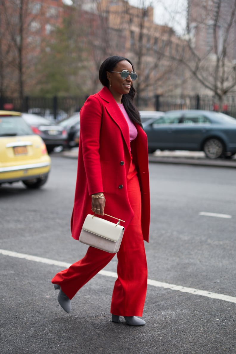 A Bold Suit, Bright Top, and White-Hot Bag