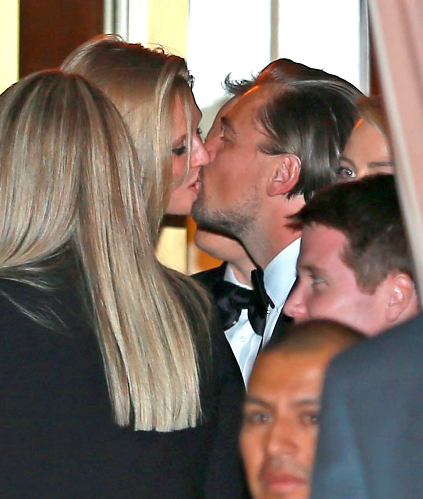 Leonardo DiCaprio got a sweet kiss from his girlfriend, Toni Garrn, outside CAA's post-Golden Globes bash in LA.