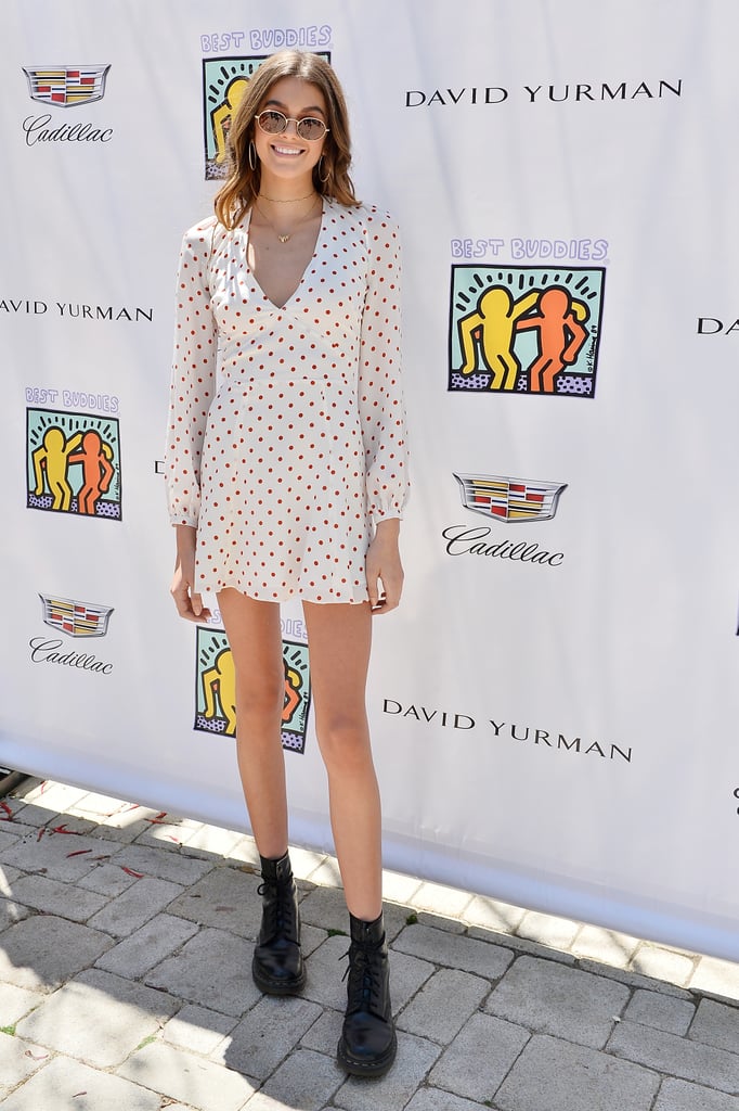 Kaia Gerber styling her boots with a polka-dot minidress.