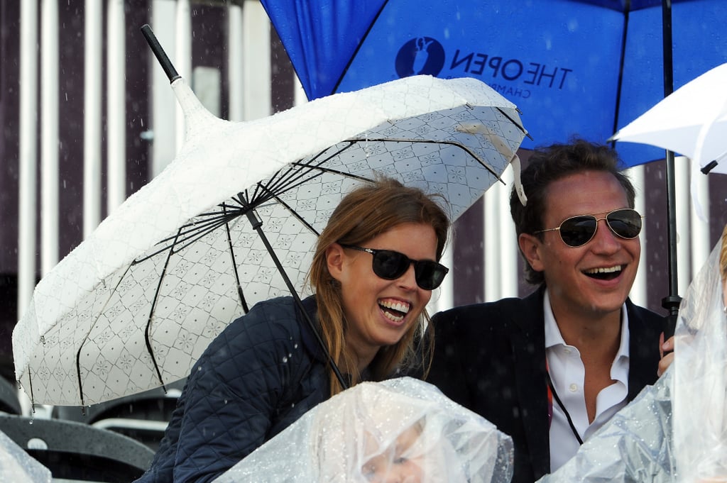 They braved the rain to attend the London Olympics.