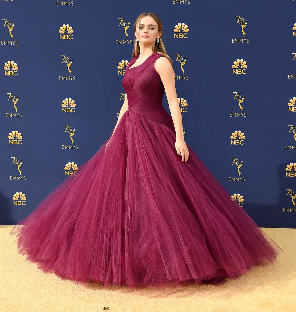 Wearing a burgundy Zac Posen dress to the 2018 Emmys.