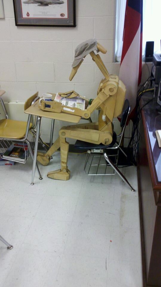 "I teach eighth grade and made this scale replica of a Star Wars droid. I dress and pose him depending on what time period we are discussing in class. His name is Roger-Roger. . . . Roger studying for class."
Source: Reddit user TheVishual via Imgur