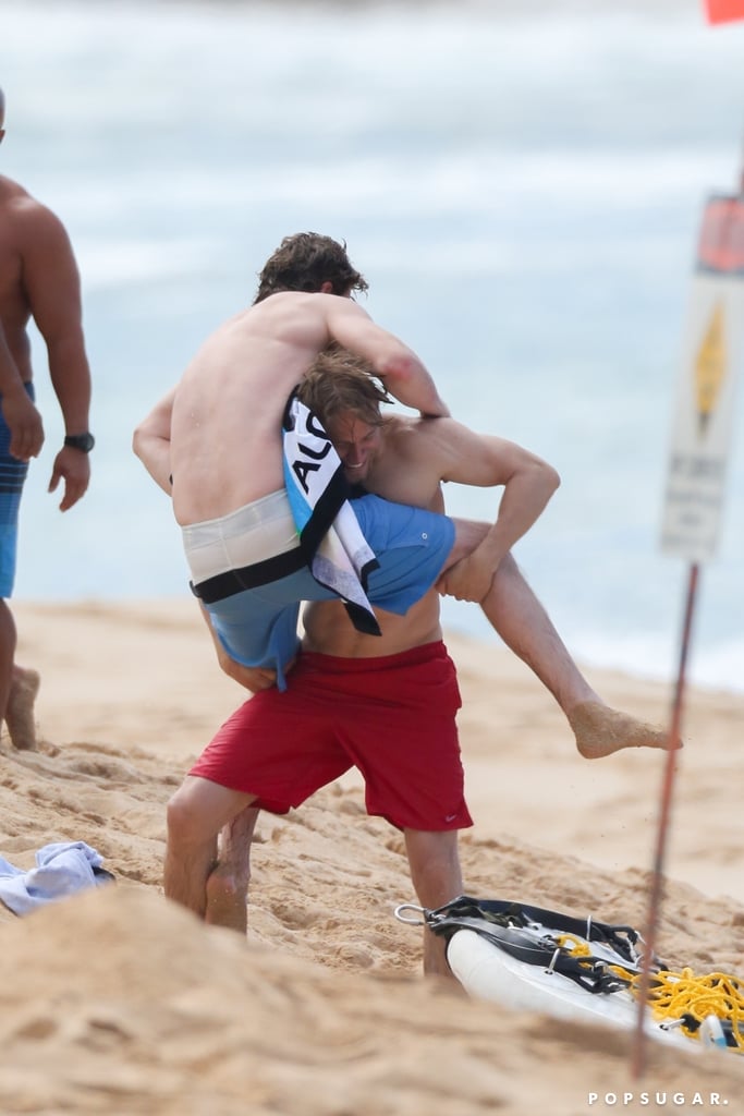 Charlie Hunnam and Garrett Hedlund had some fun on the beach in Hawaii while shooting their new movie, Triple Frontier, on Friday. The movie, which also costars Oscar Isaac and Ben Affleck, is being described as "an action-adventure flick in the border zone between Paraguay, Argentina, and Brazil." Between takes, a shirtless Charlie and Garrett were spotted play-fighting with each other while their equally attractive castmates looked on — and yes, it's everything your fantasies are made of. Check out the pictures of their wrestling session for your viewing pleasure ahead. 

    Related:

            
            
                                    
                            

            Shirtless Ben Affleck Puts His MASSIVE Phoenix Tattoo on Display — Is He a Harry Potter Fan?