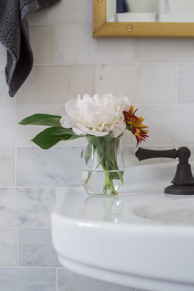 A bud vase on the sink kicks the glam factor up a notch. 
Photo by Samantha Goh via Homepolish
