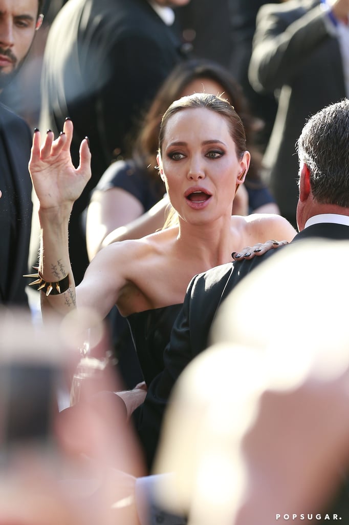 Angelina was signing autographs nearby.