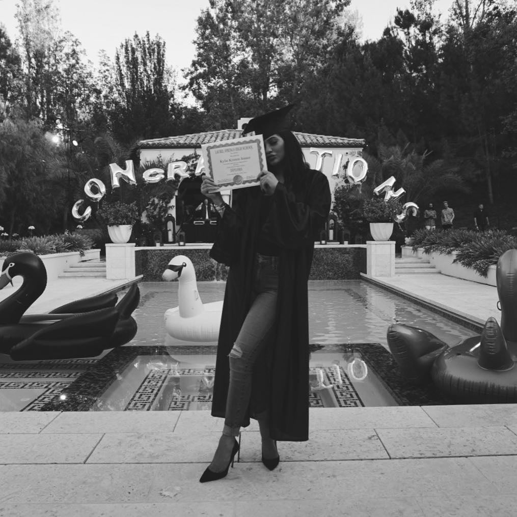 Kylie somehow made her cap and gown look sexy while posing with her diploma. Must be those years of practice on the red carpet!