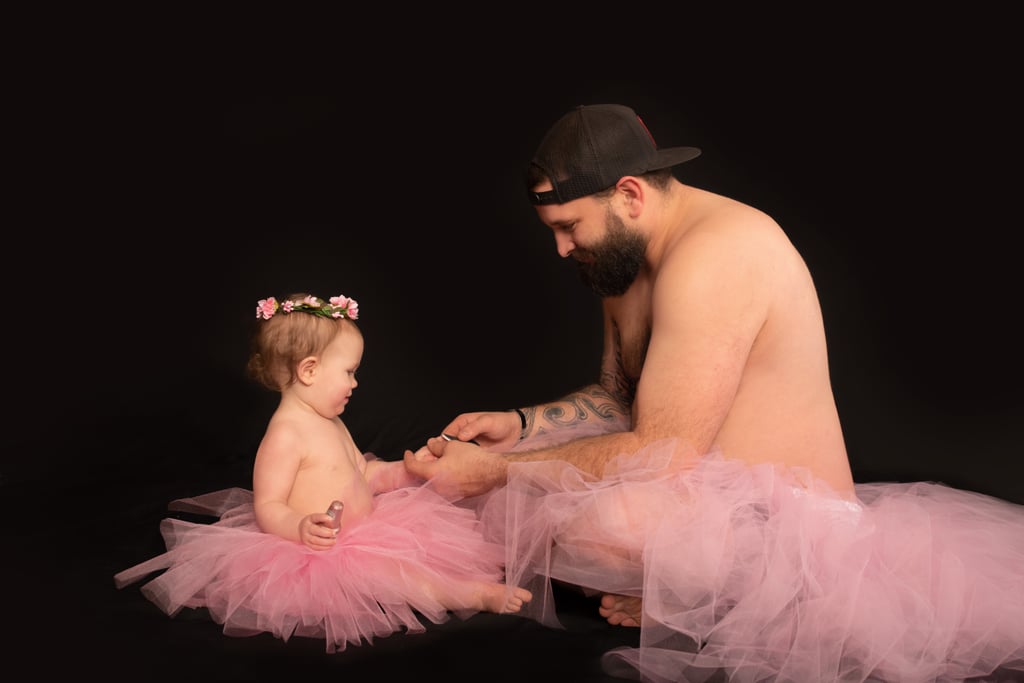 Dad and Baby Daughter Wear Matching Tutus For Photo Shoot