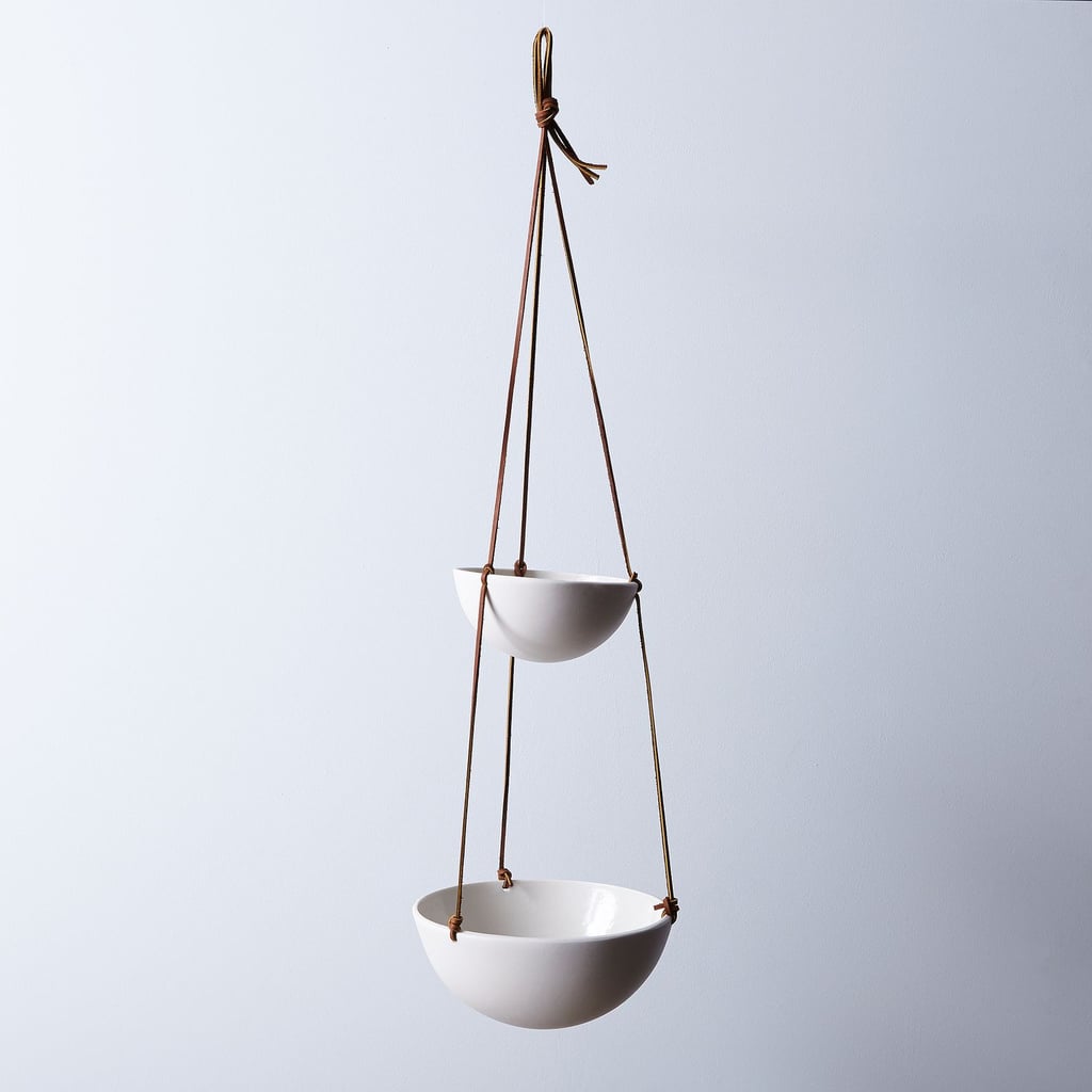 two-tiered ceramic fruit basket with leather cording