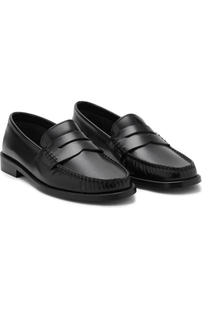 Mango Luisa Penny Loafer ($100, originally $150)
A classic pair of penny loafers will most definitely earn their keep in your closet. This pair has a moc toe, elegant banding, and a simple sole. Wear them with cute socks, your favorite pair of pants, and a sweater for an iconic cold-weather look.